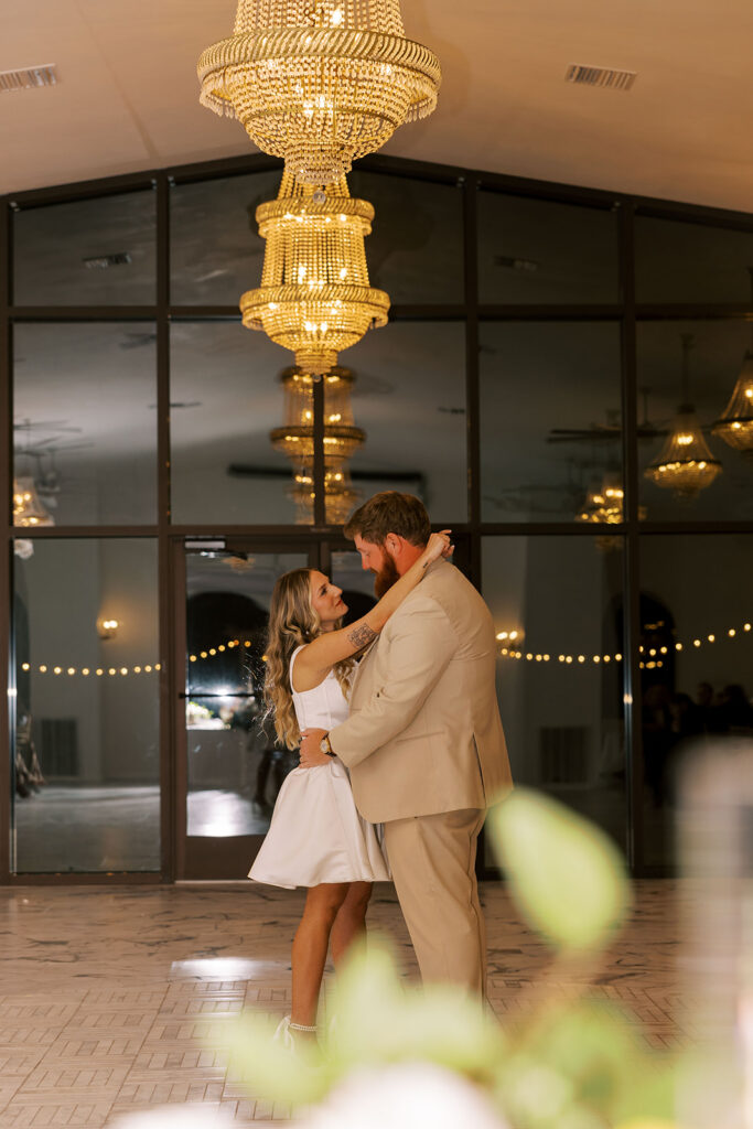 newlyweds smiling at each other
