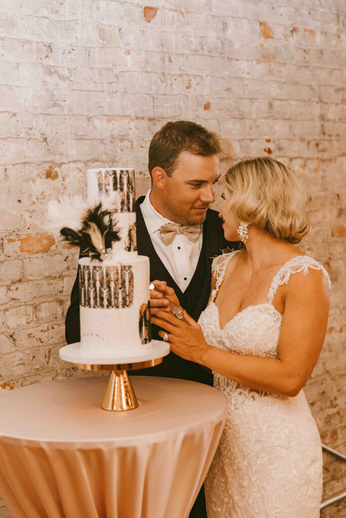 newlyweds cutting their wedding cake
