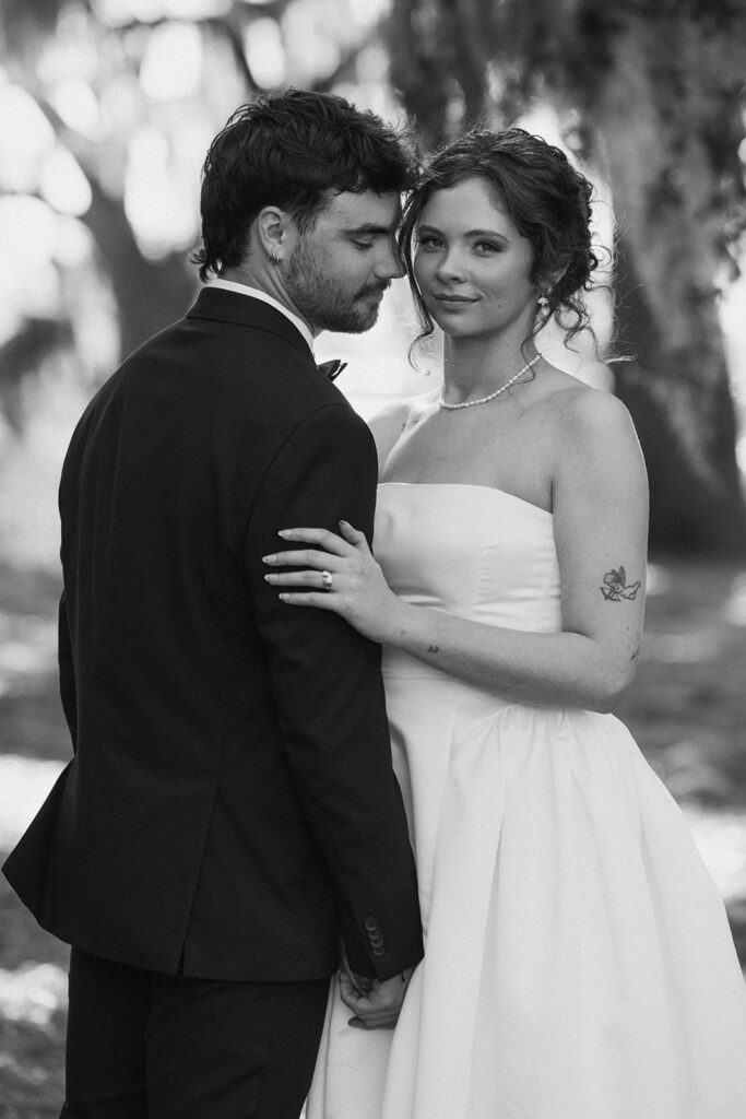 groom kissing the bride on the cheek
