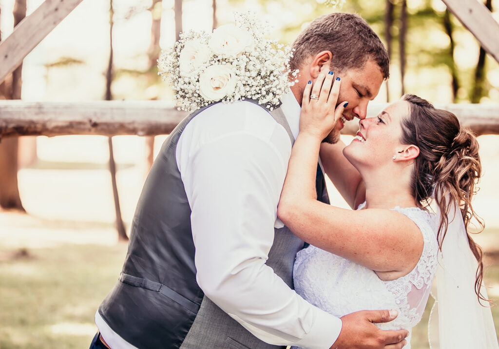 Picture of the bride and groom, smiling at each other