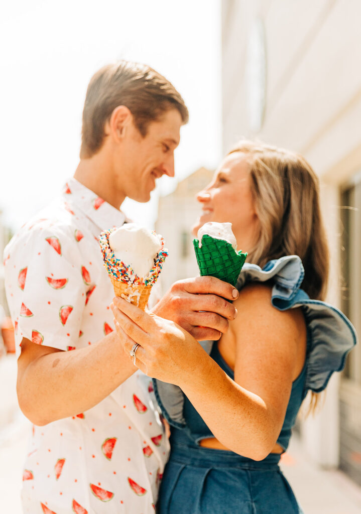 cute picture of the couple laughing with each other during their photoshoot