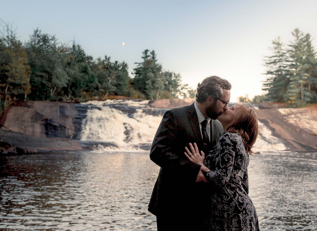 cute picture of the bride and groom kissing