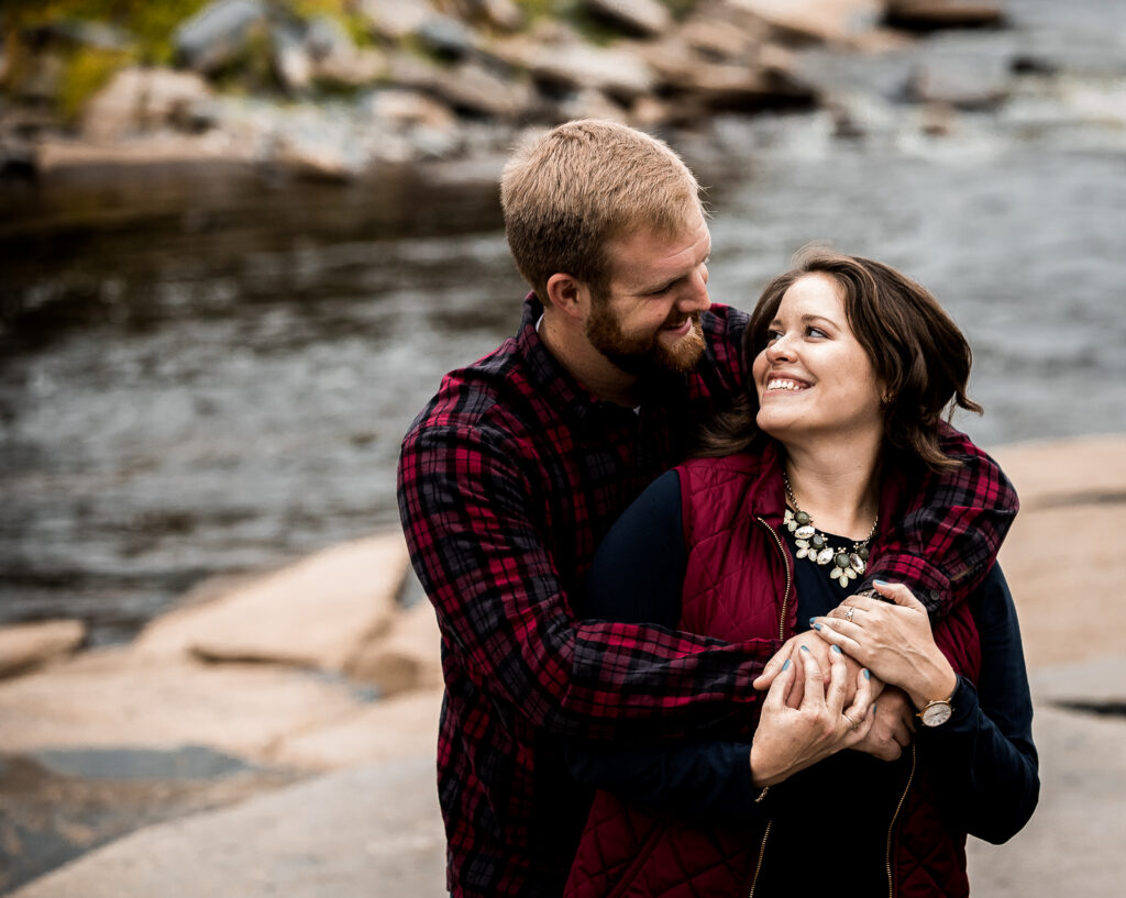 Couple smiling at each other during their photo shoot
