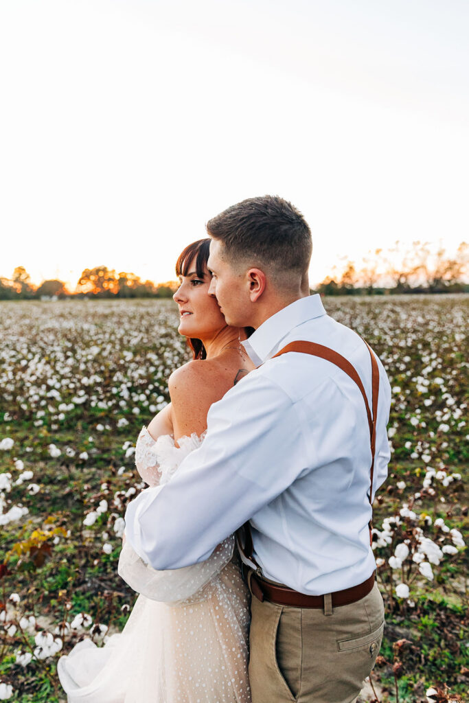 groom kissing the bride on the cheek