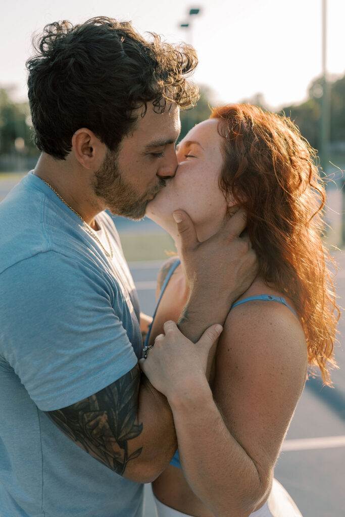 newly engaged couple kissing during their photoshoot
