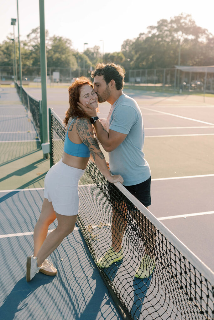 fiance kissing his fiance on the cheek