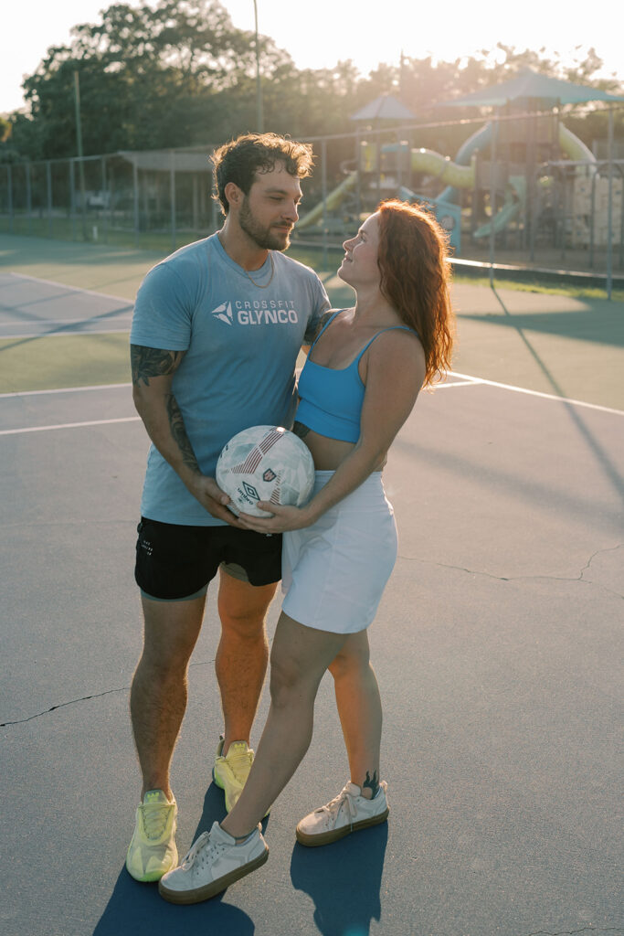cute picture of the newly engaged couple smiling