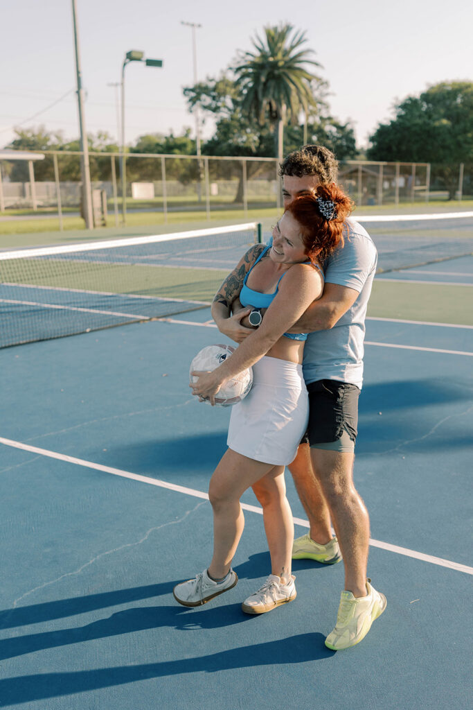 cute picture of the newly engaged couple hugging