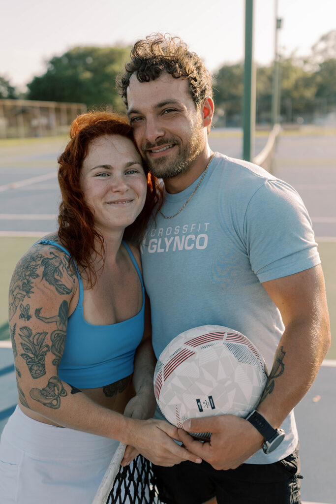 couple smiling at the camera during their photoshoot