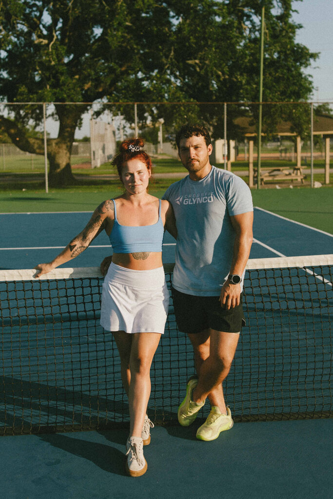 couple smiling at the camera during their photoshoot
