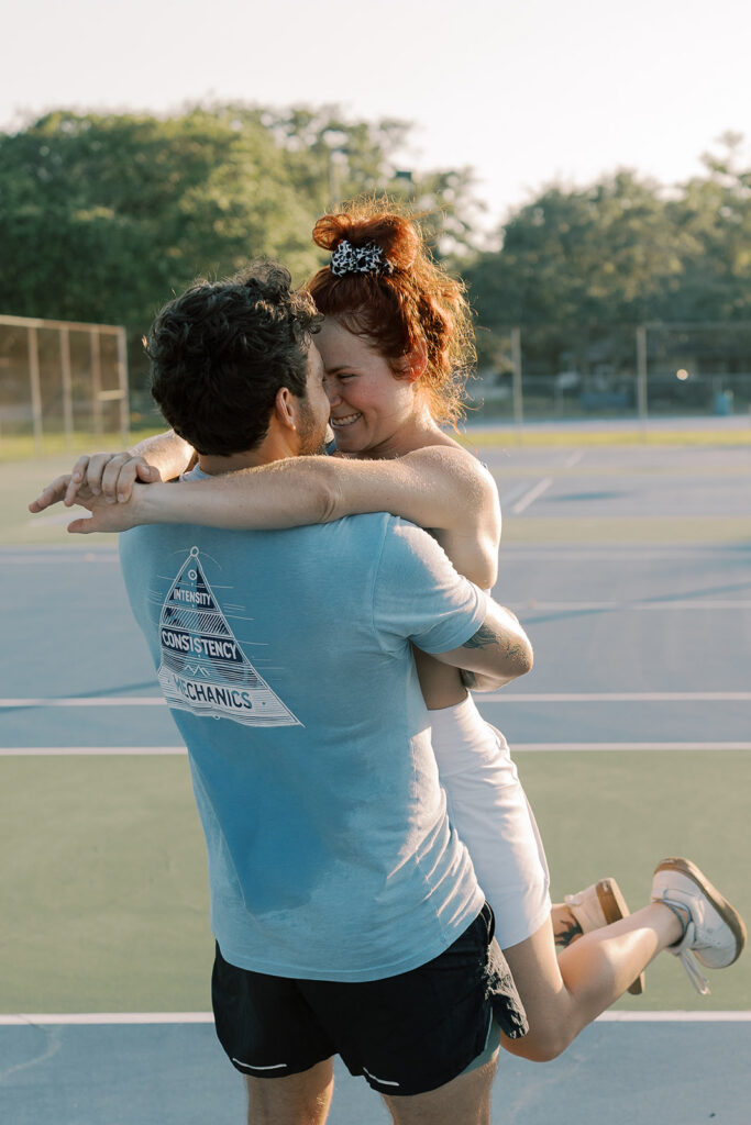 cute picture of the newly engaged couple kissing