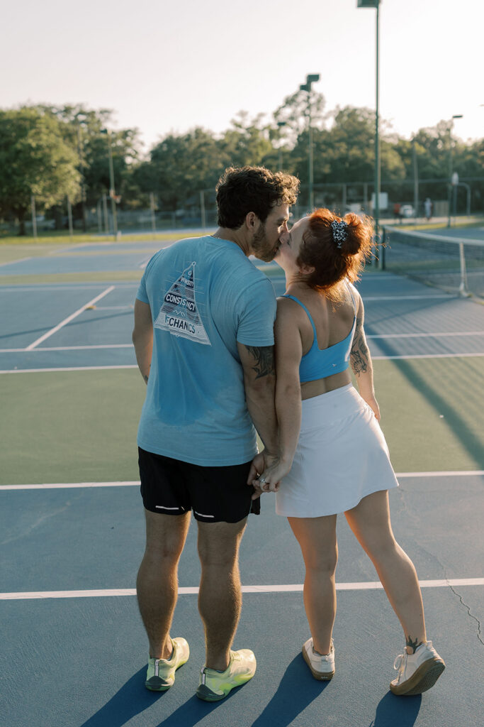 couple kissing during their playful portraits