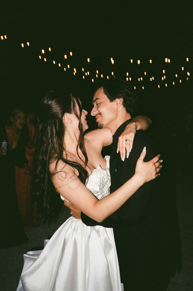 cute picture of the newlyweds smiling at each other