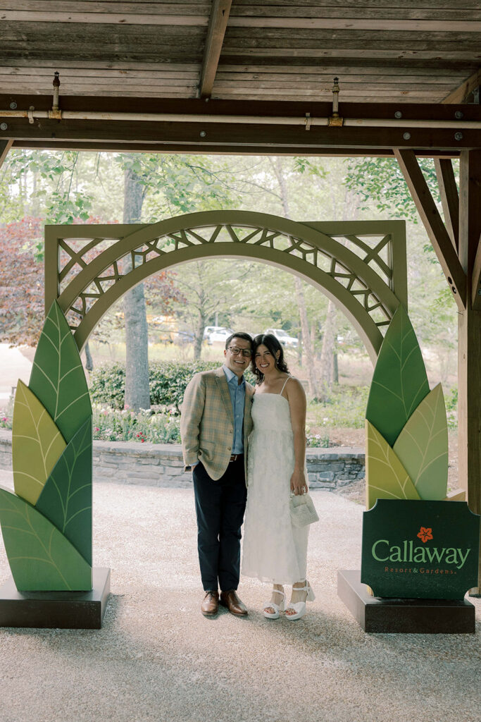 cute picture of the bride and groom smiling at the camera