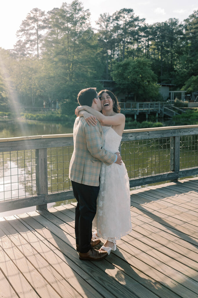 groom kissing the bride on the cheek