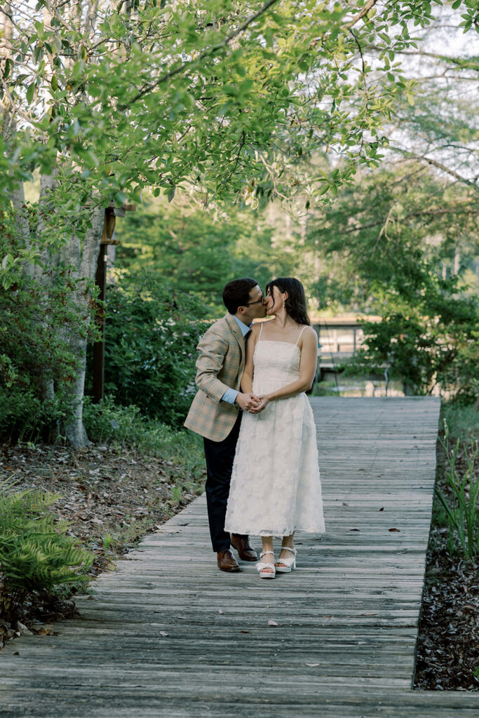bride kissing the groom on the cheek