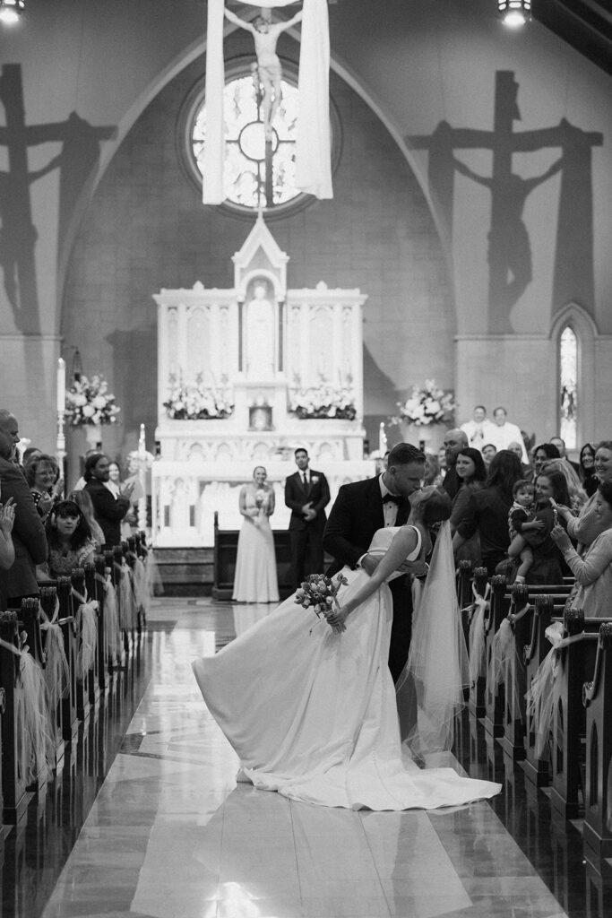 newlyweds kissing after their ceremony