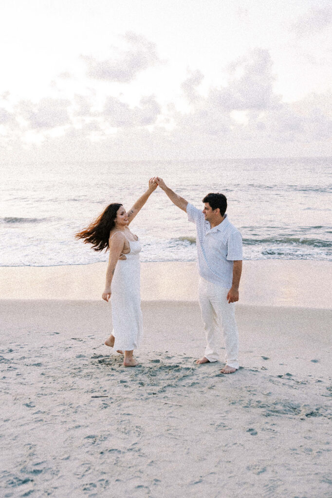 couple at their dream engagement session at the beach