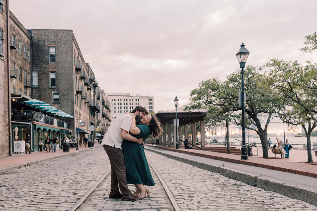 cute portrait of the newly engaged couple kissing