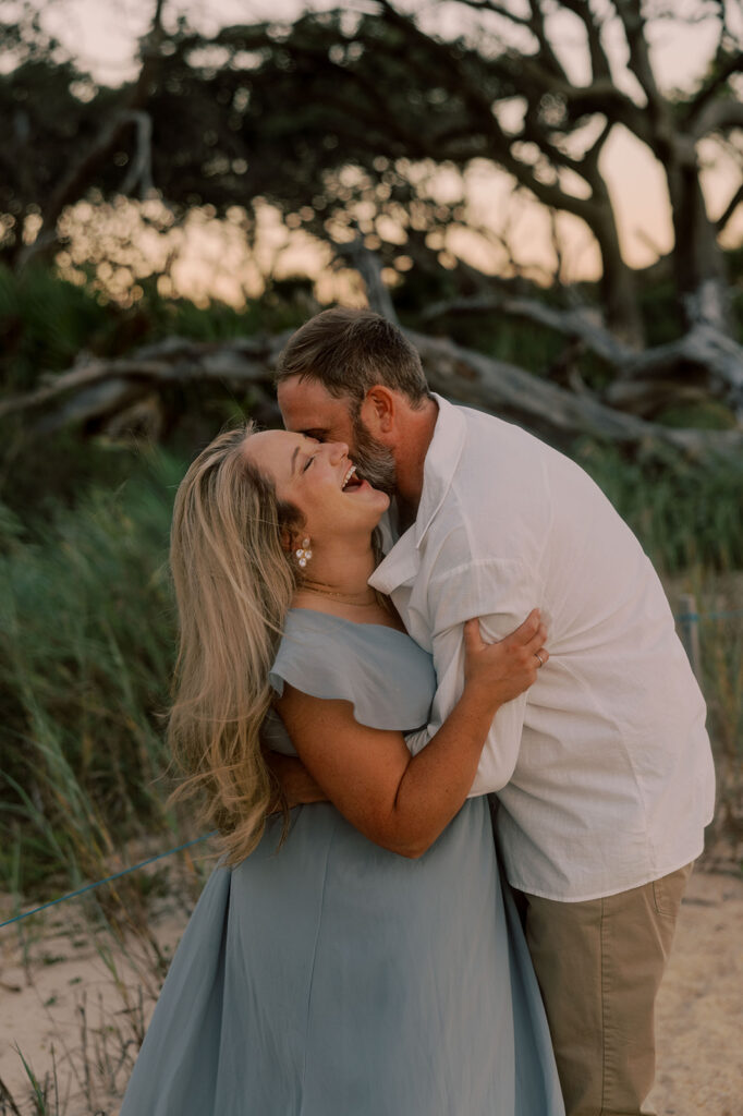 fiance kissing his fiance on the cheek