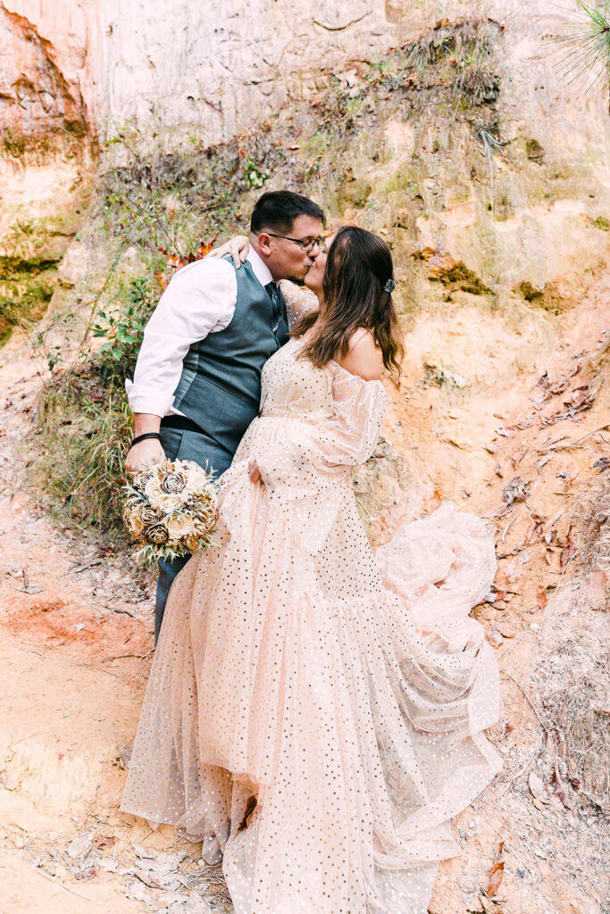 cute picture of the bride and groom kissing