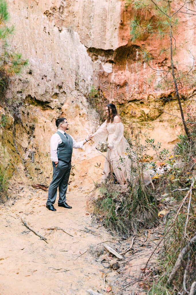 Bride and groom holding hands during their photo shoot