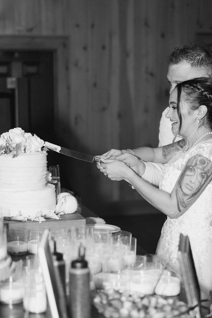 newlyweds cutting their wedding cake