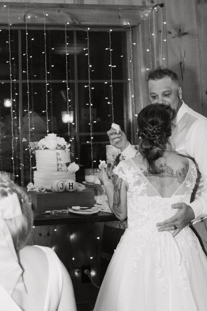 newly married couple trying their wedding cake