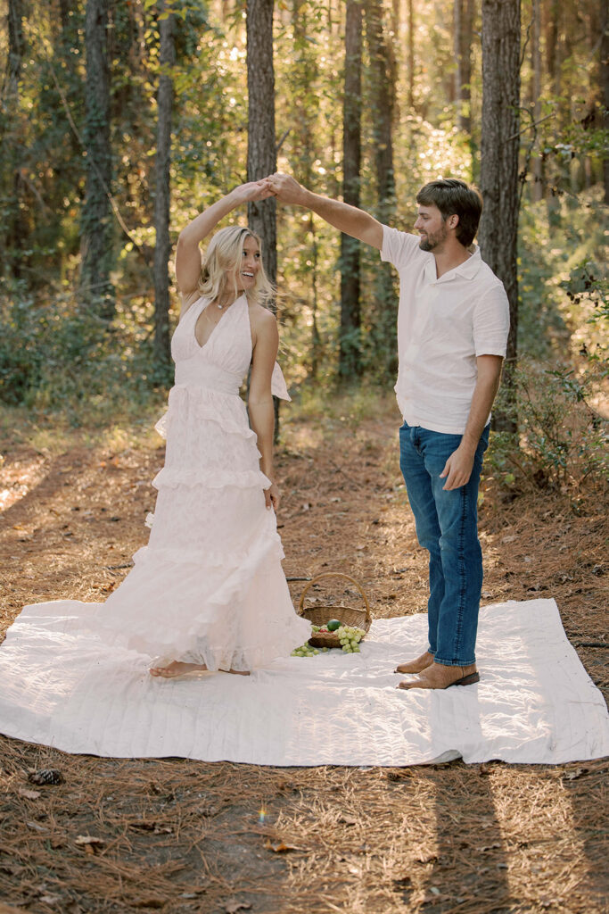 cute picture of the newly engaged couple dancing