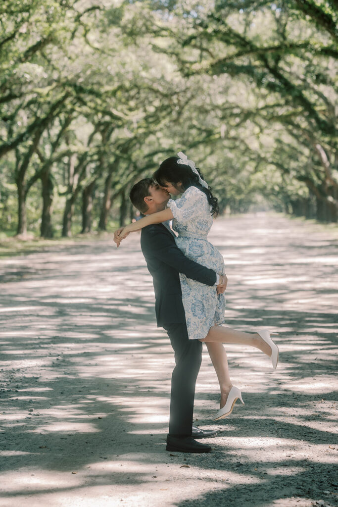 Couple smiling at each other during their portraits in Savannah