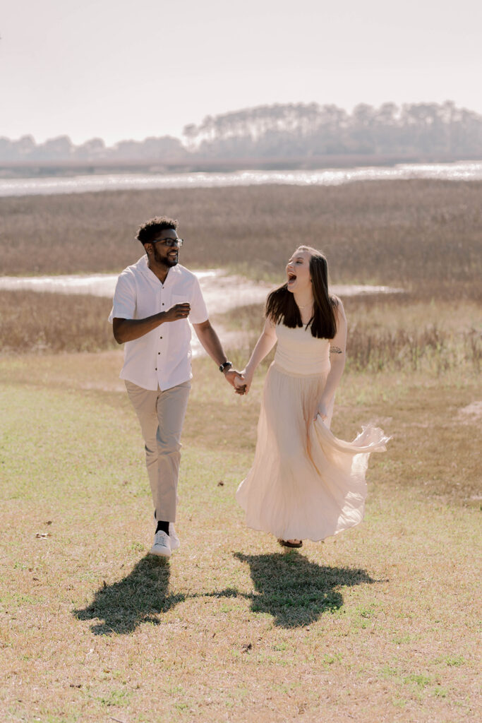 couple running with each other during their photoshoot
