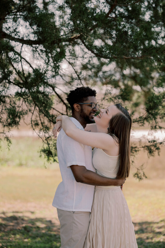 couple laughing with each other during their photoshoot