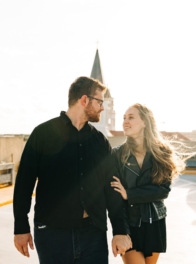 cute picture of the newly engaged couple smiling at each other
