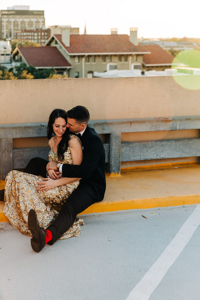 fiance kissing his fiance on the cheek