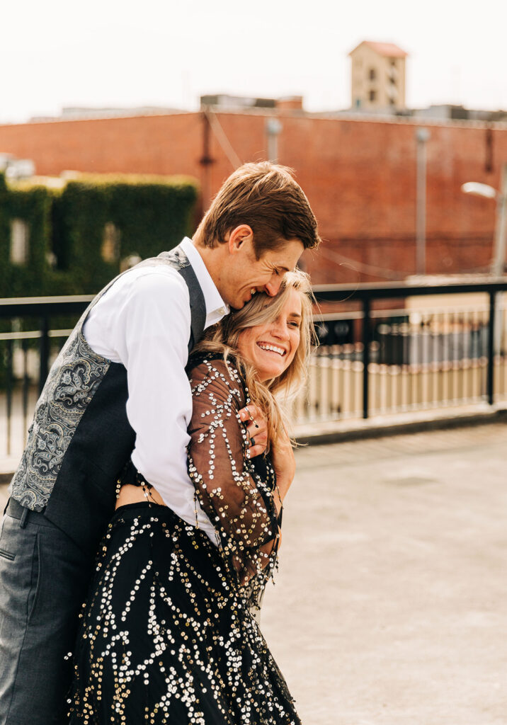 cute picture of the newly engaged couple smiling at each other