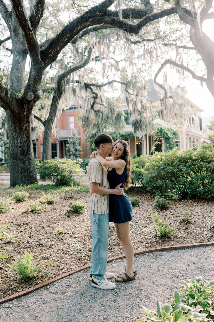 fiance kissing his fiance on the cheek