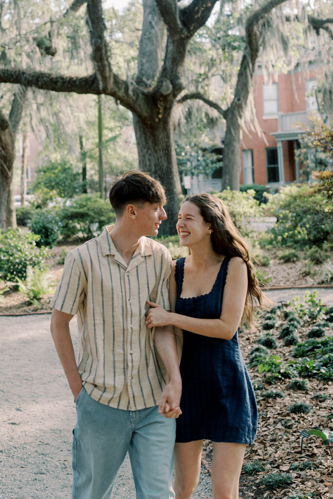 cute picture of the newly engaged couple smiling at each other